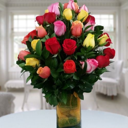 36 roses mixed colors in glass vase