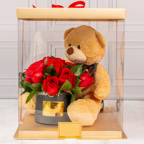 Floral arrangement with red roses and premium teddy bear in golden acetate box – Medellín delivery
