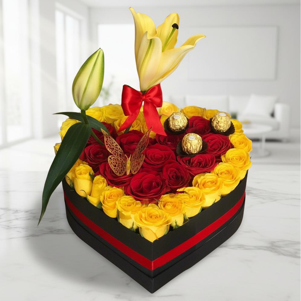 Heart-shaped box with yellow and red roses, lilies, Ferrero Rocher chocolates, and butterfly decoration – Same-day delivery in Acacías, Meta