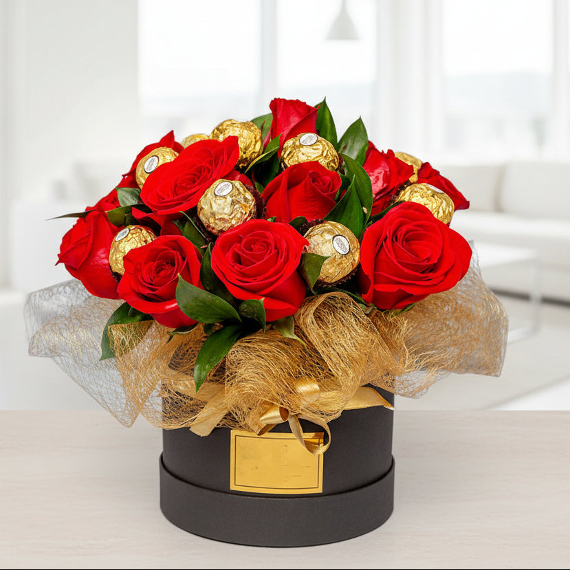 Luxury floral arrangement with red roses and Ferrero chocolates, available for delivery in Medellín and Bogotá