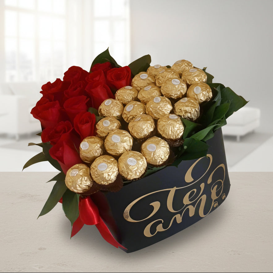 Luxury gift box with fresh red roses and Ferrero Rocher chocolates arranged in a black box with 'Te Amo' written in gold lettering, tied with a red ribbon – perfect for romantic occasions and same-day delivery in Cali