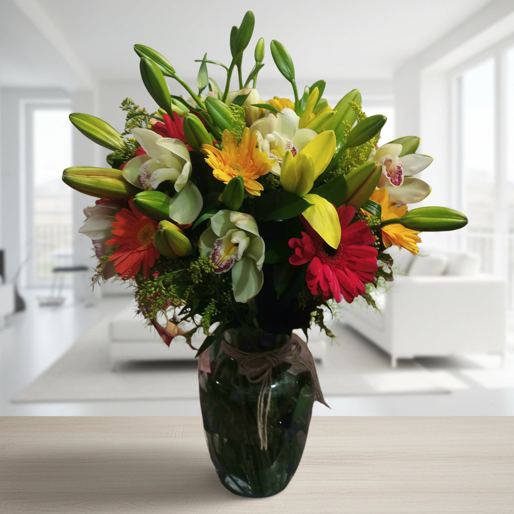Orchid, gerberas and lilies in elegant glass vase – Flower delivery in Medellin
