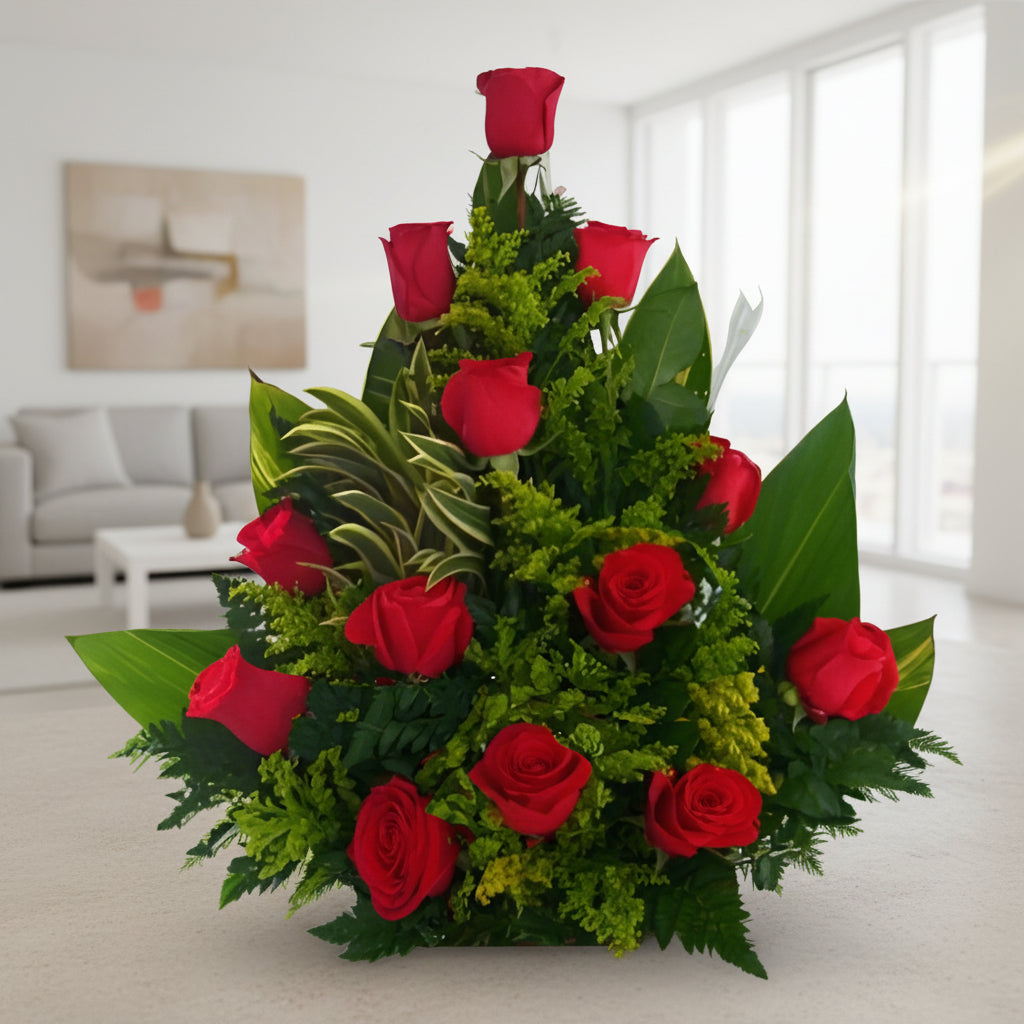 triangular arrangement of fresh red roses with lush greenery, perfect for anniversaries, birthdays, or romantic gestures. Available for delivery in Cali, Bogotá, Cúcuta and more.