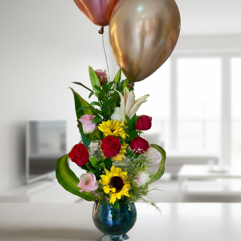 Glass vase with 11 roses, lilies, sunflowers, and greenery – flower arrangement for delivery in Arboletes, Antioquia