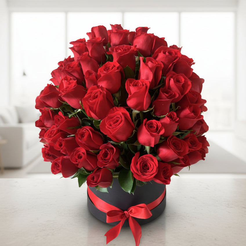 Round arrangement of 100 red roses in a luxury box with seasonal foliage-Flowers to Colombia