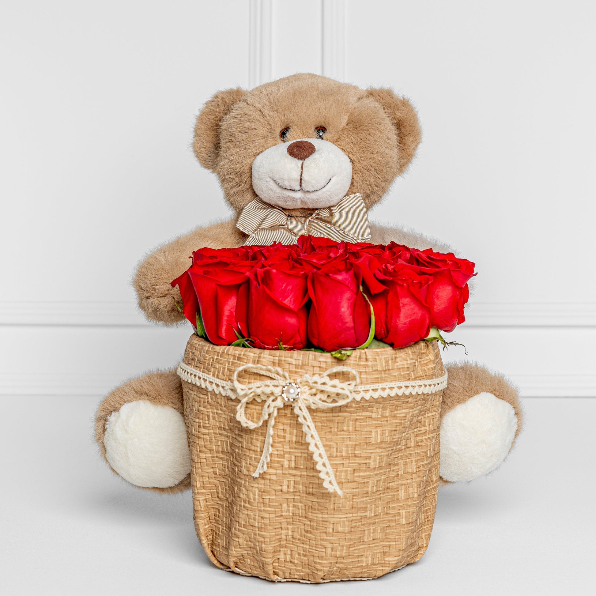 Luxury teddy bear holding basket with fresh red roses – Medellín same day delivery