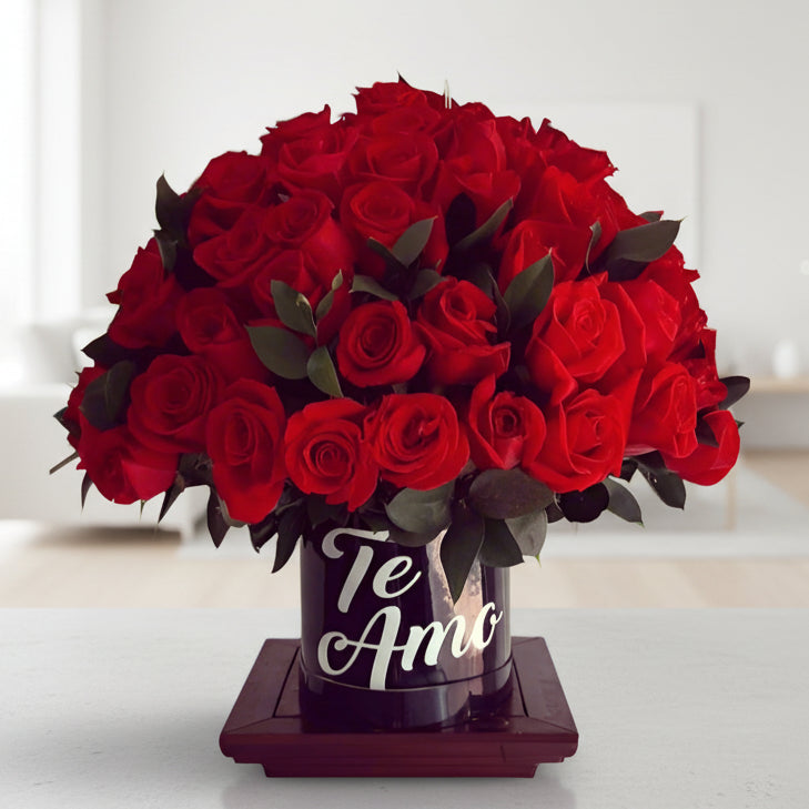 Elegant arrangement of fresh red roses in a black box with 'Te Amo' written in white. Perfect for romantic occasions with same-day delivery in Cali.