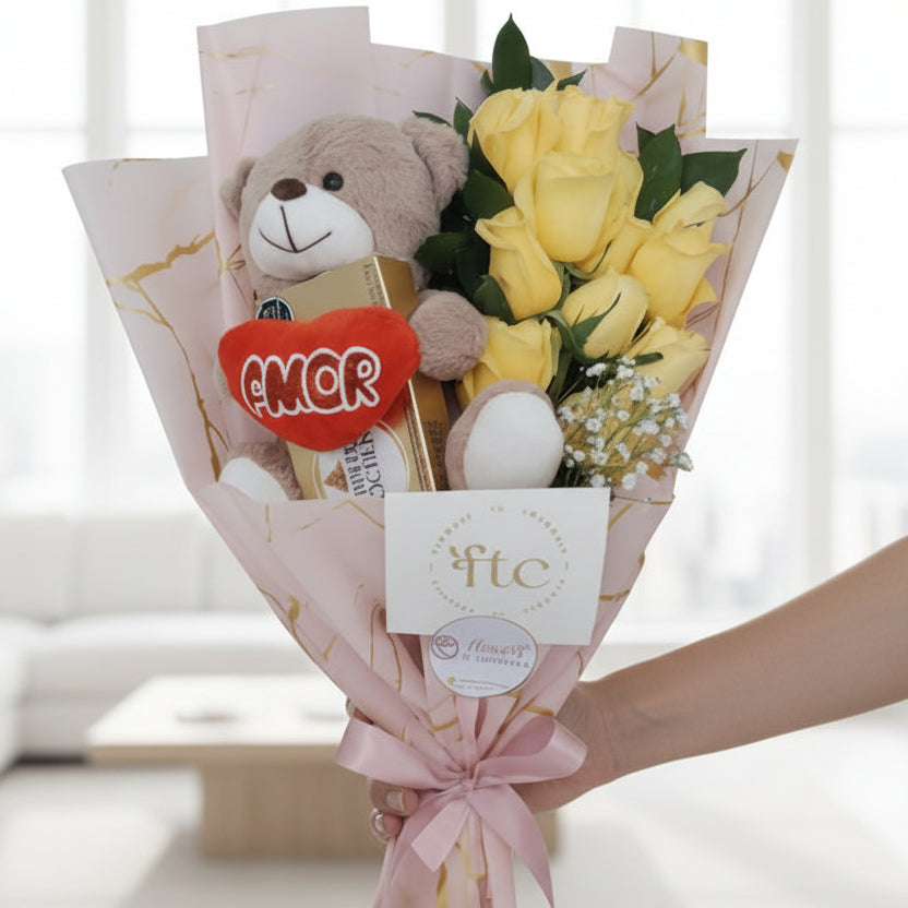 Romantic bouquet with yellow roses, a soft teddy bear, and chocolates, beautifully wrapped and ideal for flower delivery in Bucaramanga, Colombia.