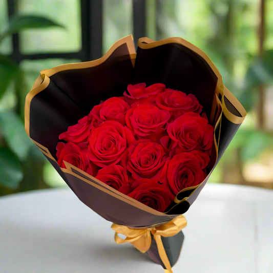Bouquet of 12 red roses wrapped in elegant black Korean paper with golden edge