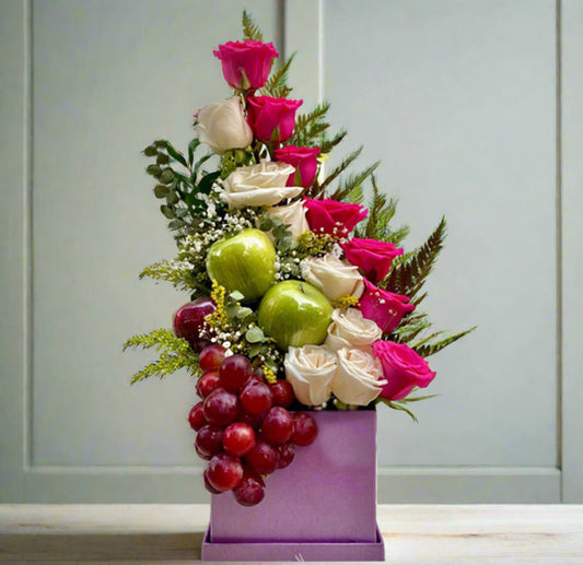 Gift box with pink and white roses, green apples, and red grapes in lilac box – Arboletes delivery
