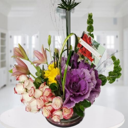 Arrangement of roses, lilies and tropical flowers. Available for Bogota only.