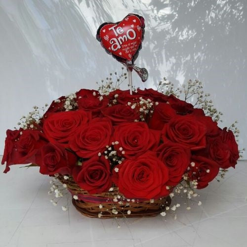 Two dozen red roses in a basket and small balloon