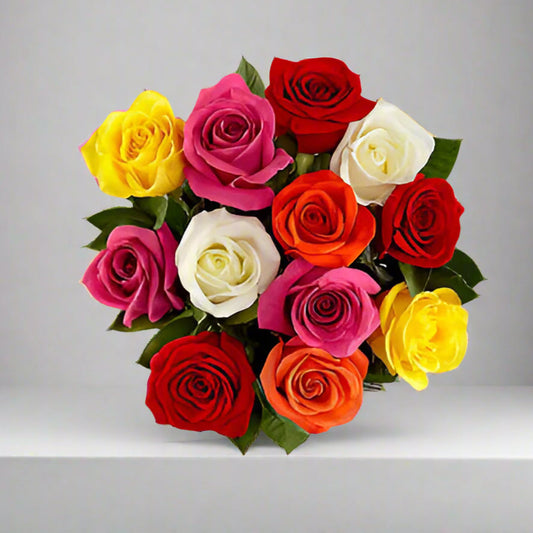 Bouquet of 12 mixed-color roses including red, yellow, white, orange, and pink for delivery in Medellín, Bogotá, Cali, and all of Colombia.