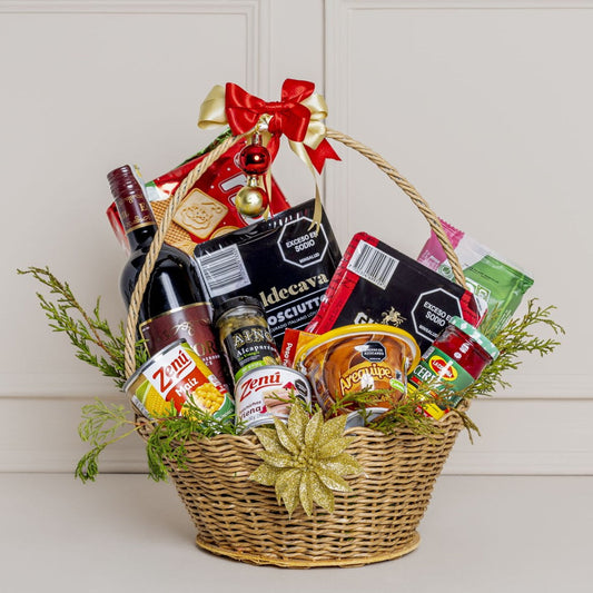 Gift basket with wine, snacks, and other items on a white background