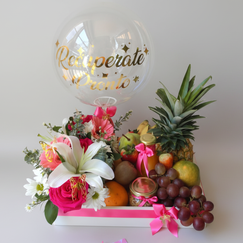 Fresh fruit and flower gift box with pineapple, grapes, strawberries, assorted flowers, and personalized bubble balloon in a white wooden box for delivery in Pereira