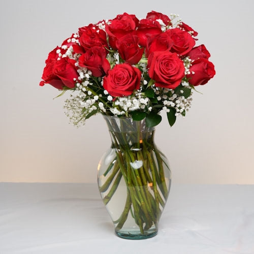 18 red roses in vase to Colombia