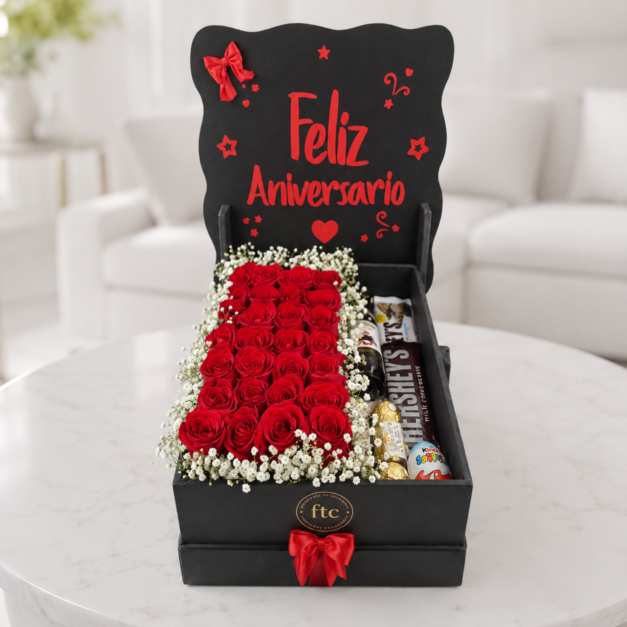 Luxury anniversary gift box with premium red roses, baby's breath, assorted chocolates, and an elegant "Happy Anniversary" display for same-day flower delivery in Restrepo, Meta.