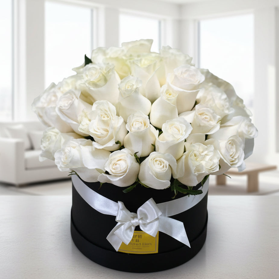 Luxury black box with 50 white roses for sympathy and condolence delivery in Colombia