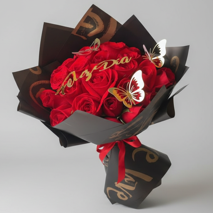 Luxury bouquet of red roses with decorative butterflies and “Love” message, wrapped in elegant black paper and ribbon for delivery in Pereira