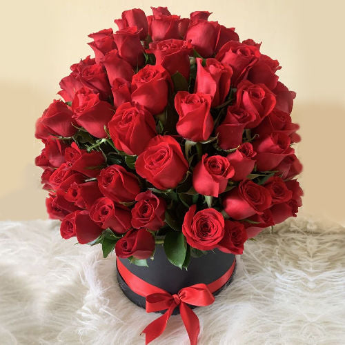 Round arrangement of 100 red roses in a luxury box with seasonal foliage-Flowers to Colombia
