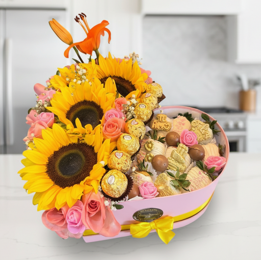 Luxury gift box with sunflowers, pink roses, Ferrero Rocher chocolates, and chocolate-covered strawberries for same-day delivery in Restrepo, Meta.