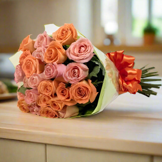 Bouquet of 24 roses with a mix of yellow and orange roses, available for delivery across Colombia.